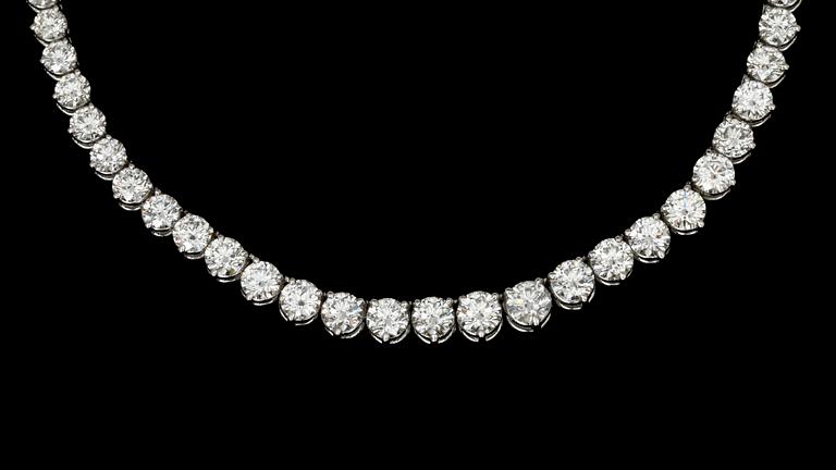 A brilliant cut diamond riviérè necklace, tot. app. 22 cts.