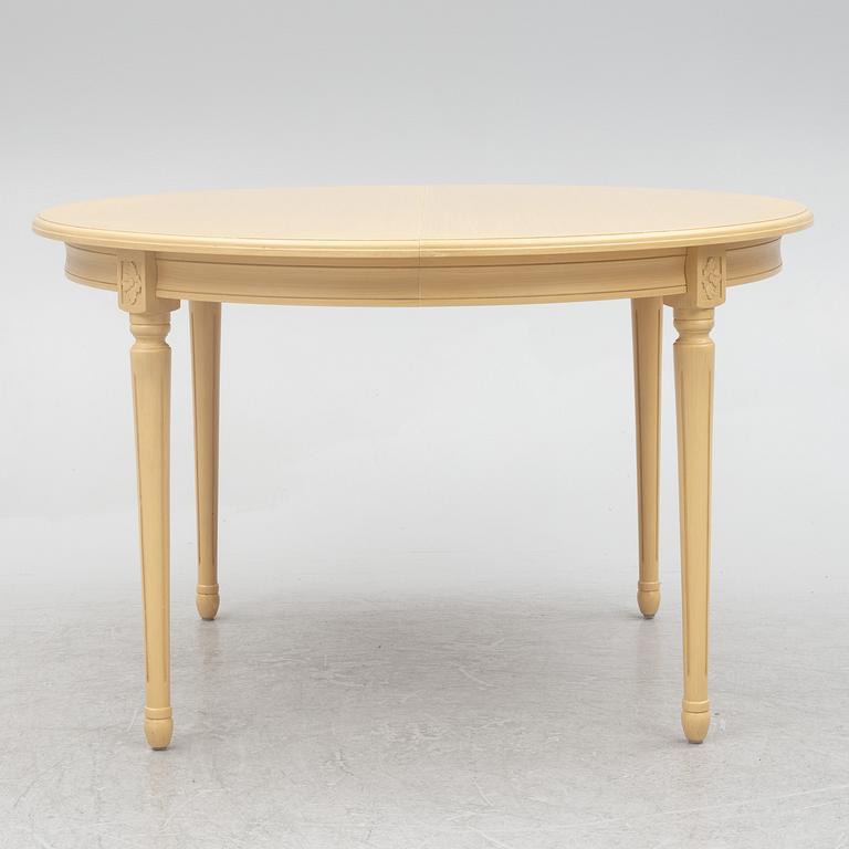 A Gustavian style dining table with six dining chairs, Sweden, 21st century.