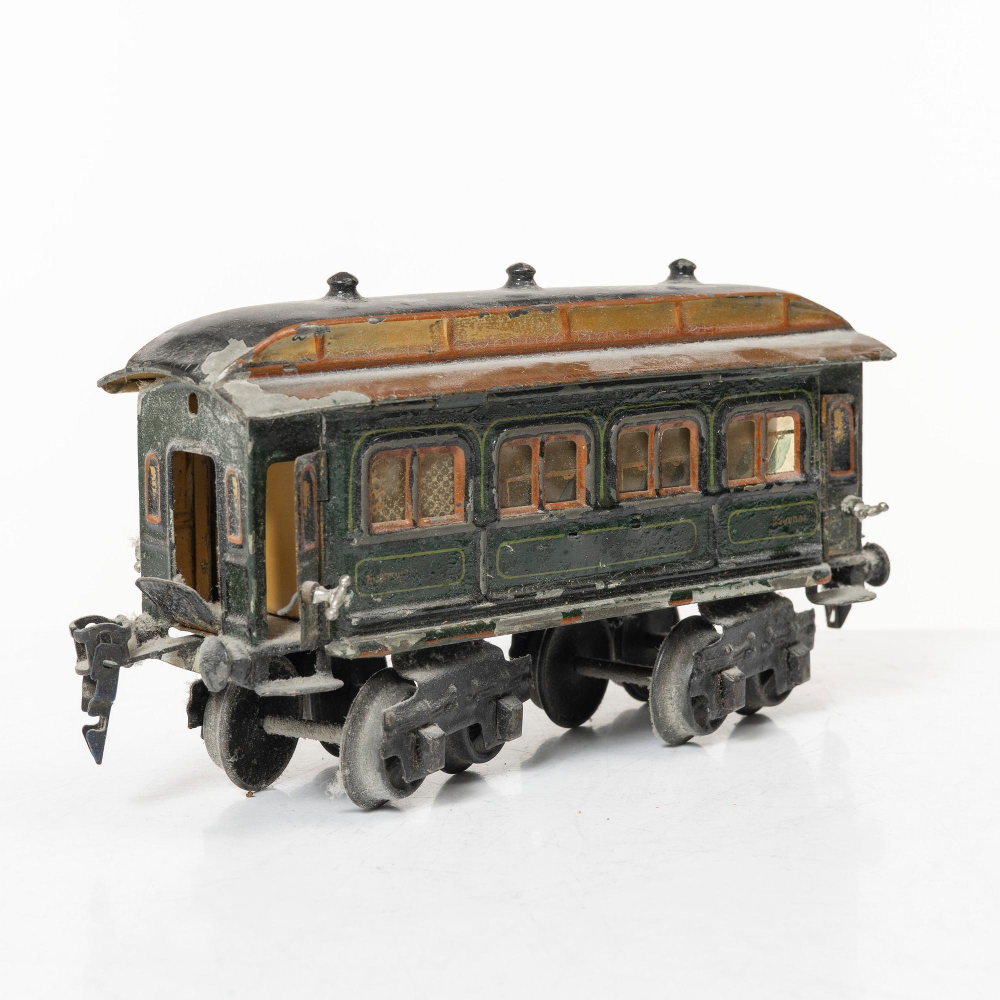 Model train with track and station building, 13 pieces, Germany, 1920s.