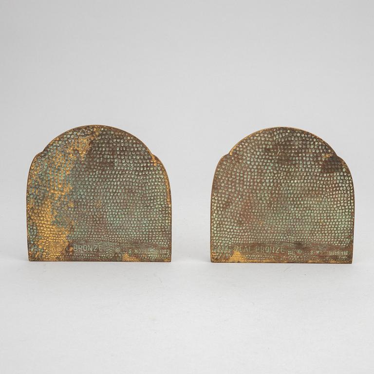 Simon Moselsio, a pair of bronze bookends, 20th Century.