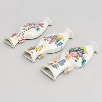 A set of three Chinese porcelain wall vases, late Qing dynasty around the year 1900, and 20th century.