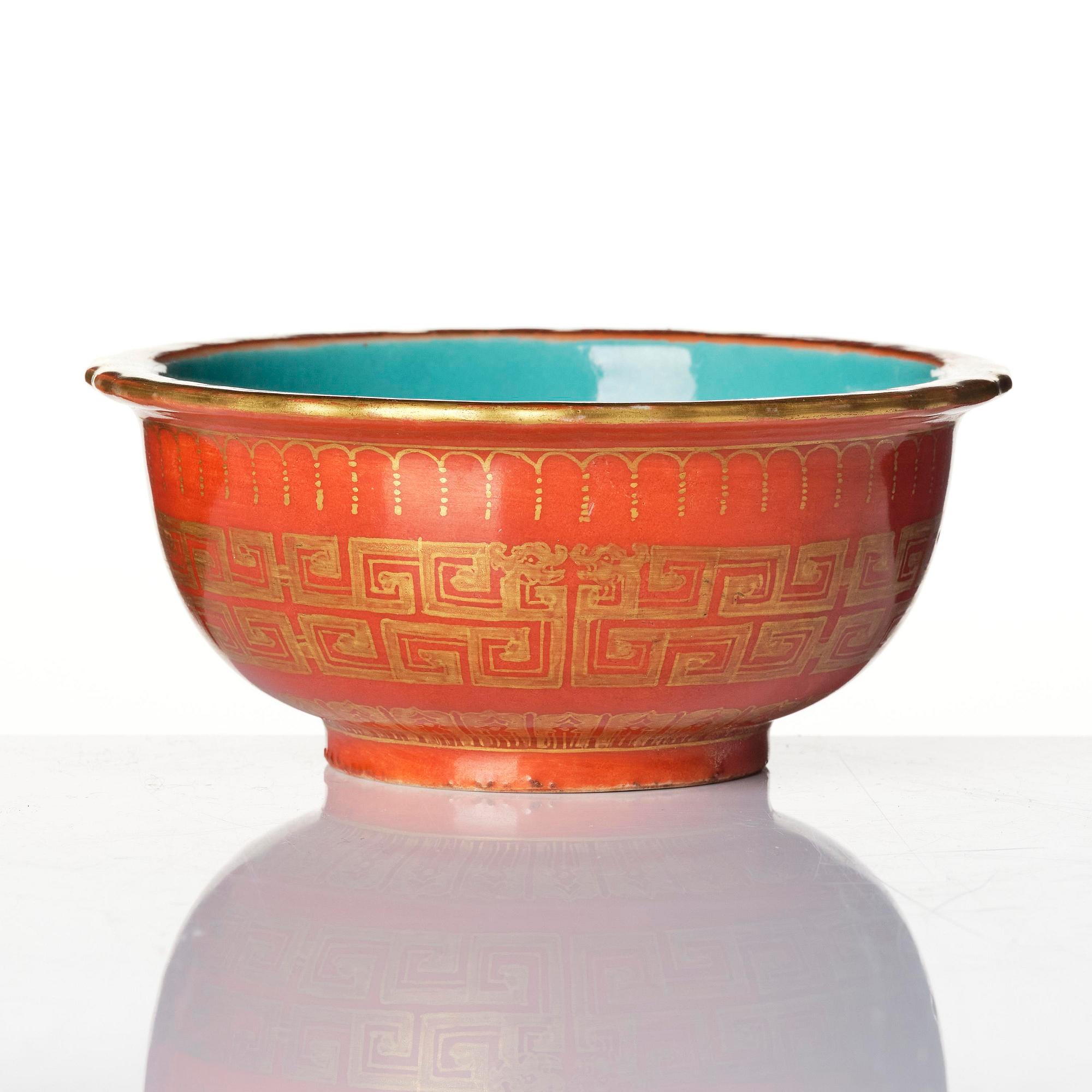 A coral red ground and gilt decorated turquoise enamelled bowl, Qing dynasty, Daoguang mark and period (1821-50).