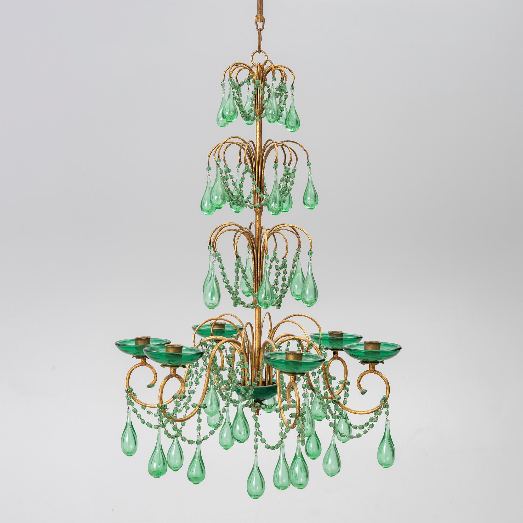 A chandelier, likely from Italy, circa 1950.