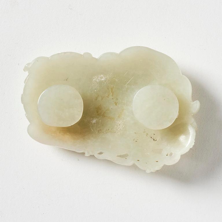 A jade belt buckle in the shape of a buddhist lion, Qing dynasty, 18th century.