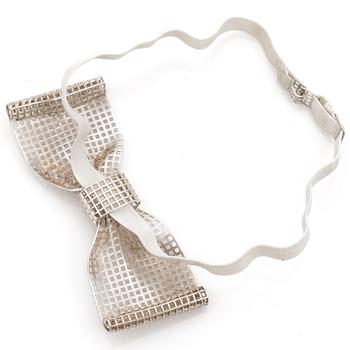 A silver bow-tie.