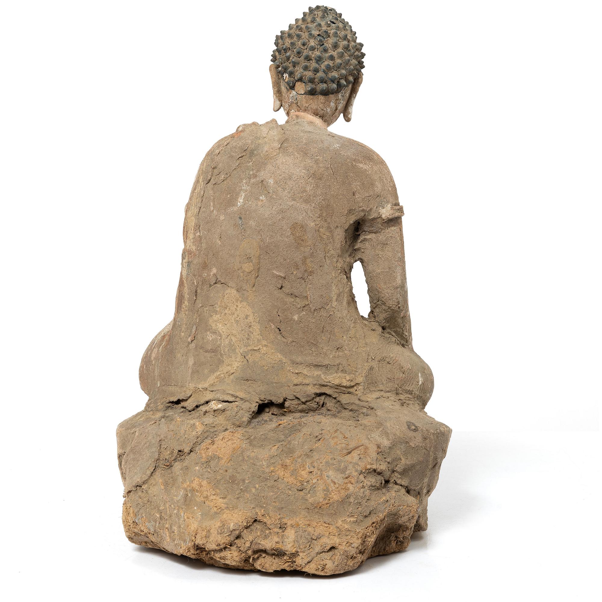 A Southeast Asian figure of a Buddha, 20th century.