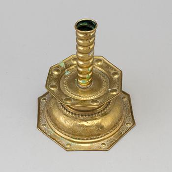 A 18th century Baroque brass candlestick.