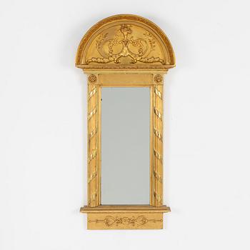 A giltwood Empire mirror by J. P. Holmberg (active in Stockholm 1813 - 1831).