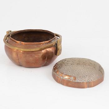 A Chinese copper handwarmer, late Qing dynasty.