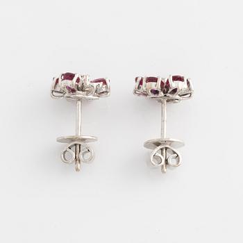 Earrings, one pair, white gold with rubies and small diamonds.