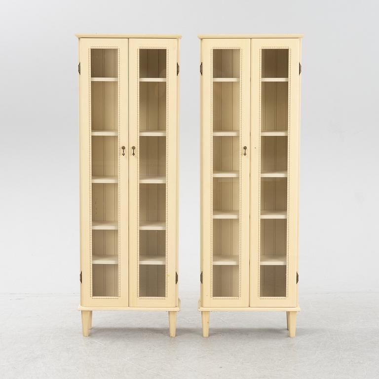 A pair of Gustavian style book cabinets, 21st century.