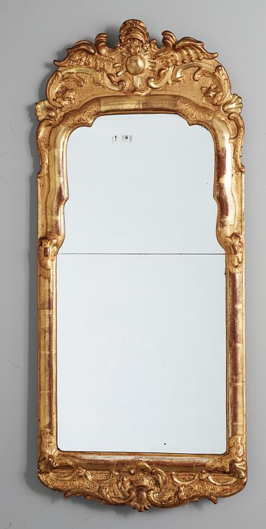 A Rococo mirror, 18th century.