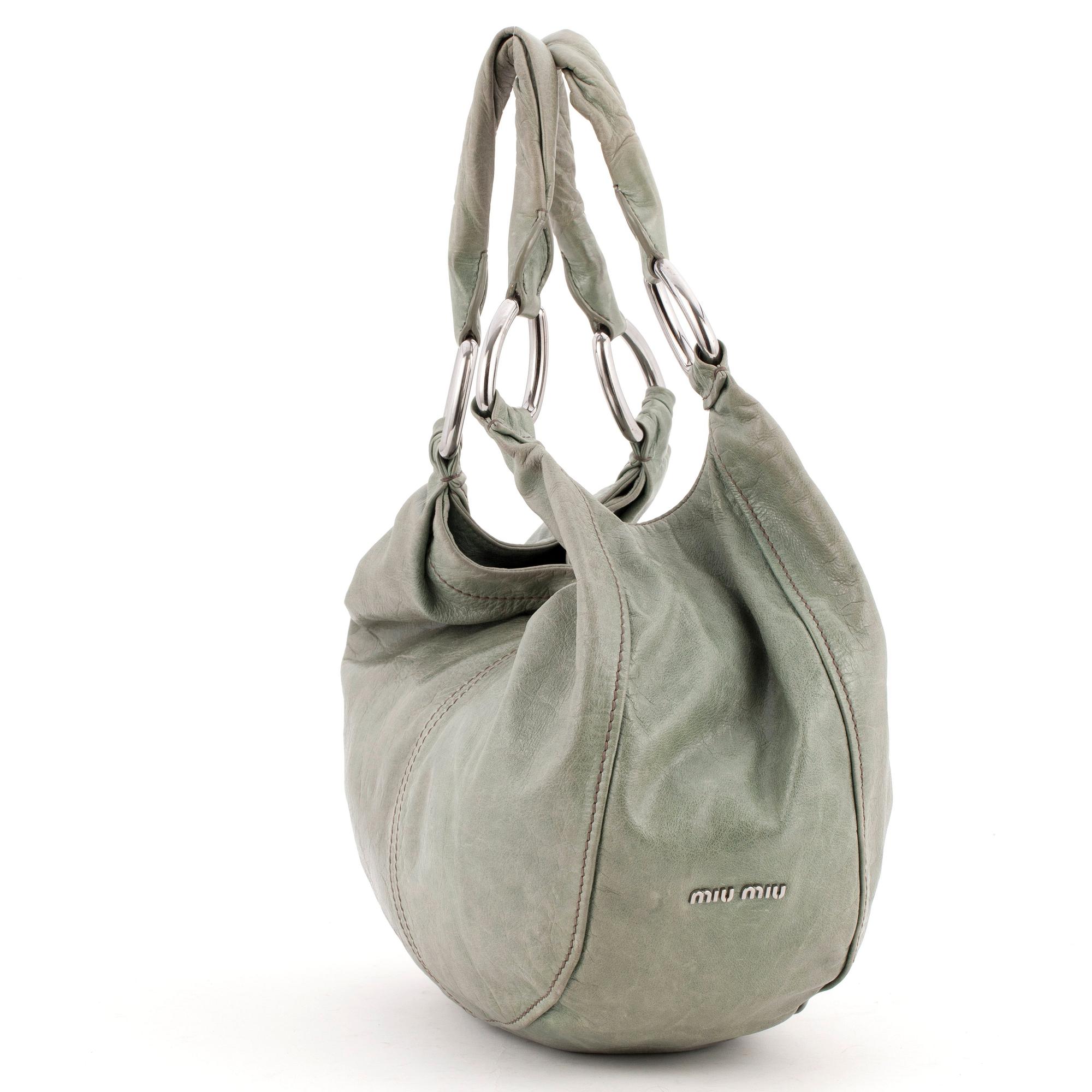 MIU MIU, a green leather shoulder bag.