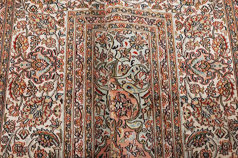 A carpet, silk Kashmir, ca 303 x 216 cm.