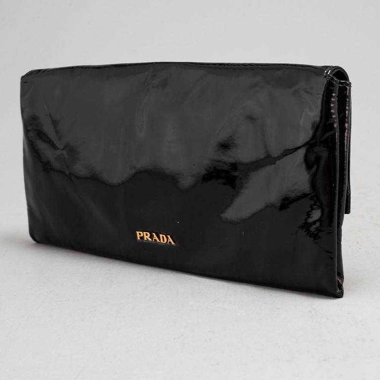 PRADA, a clutch.