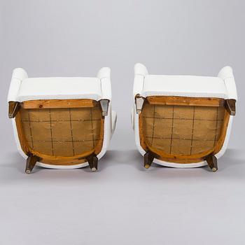 A pair of 1950s armchairs.