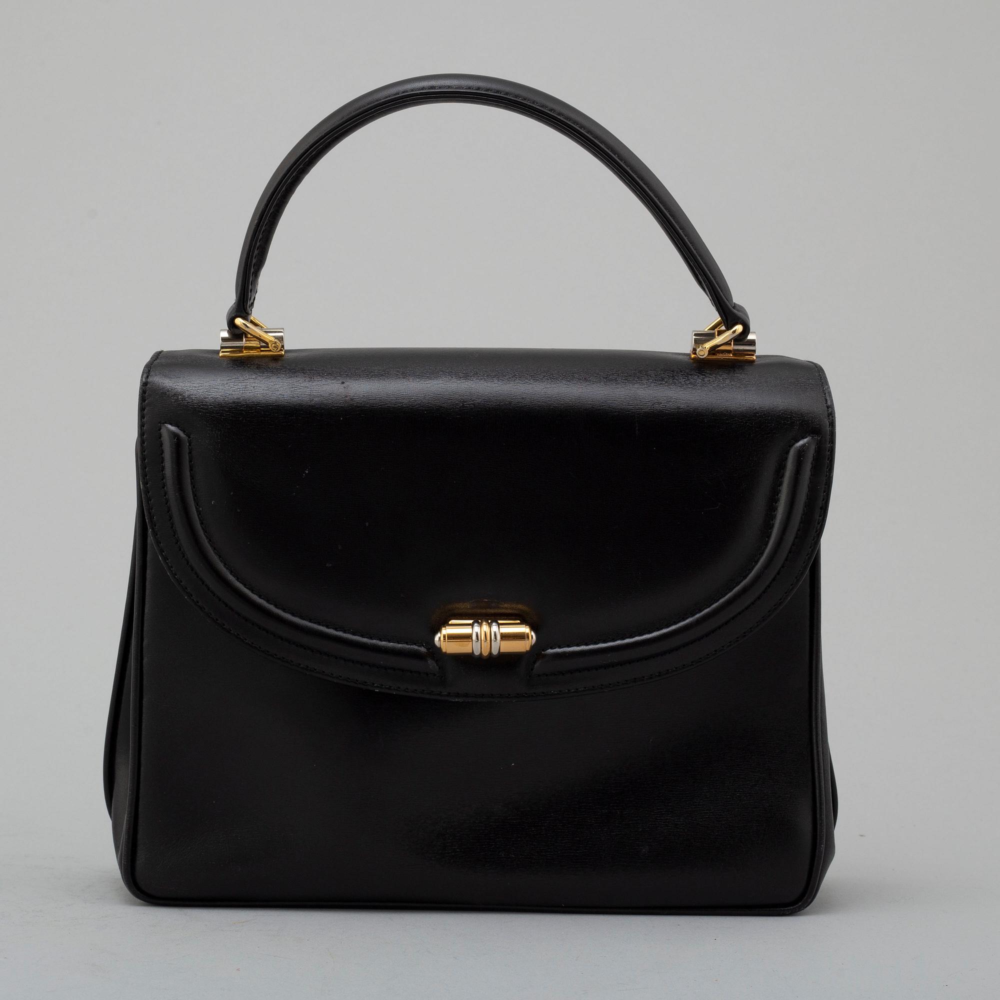 GUCCI, black leather bag.