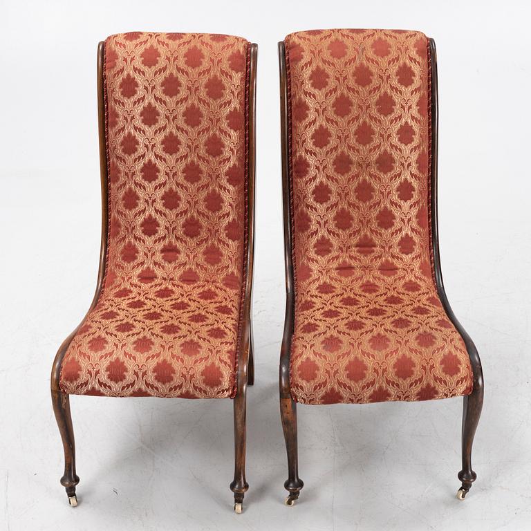 A pair av easy chairs, 19th Century.