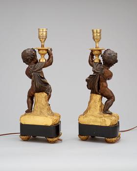 A pair of Louis XVI-style circa 1900 table lamps.