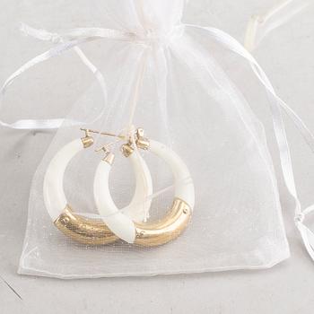 A pair of Dolce & Gabbana earrings.