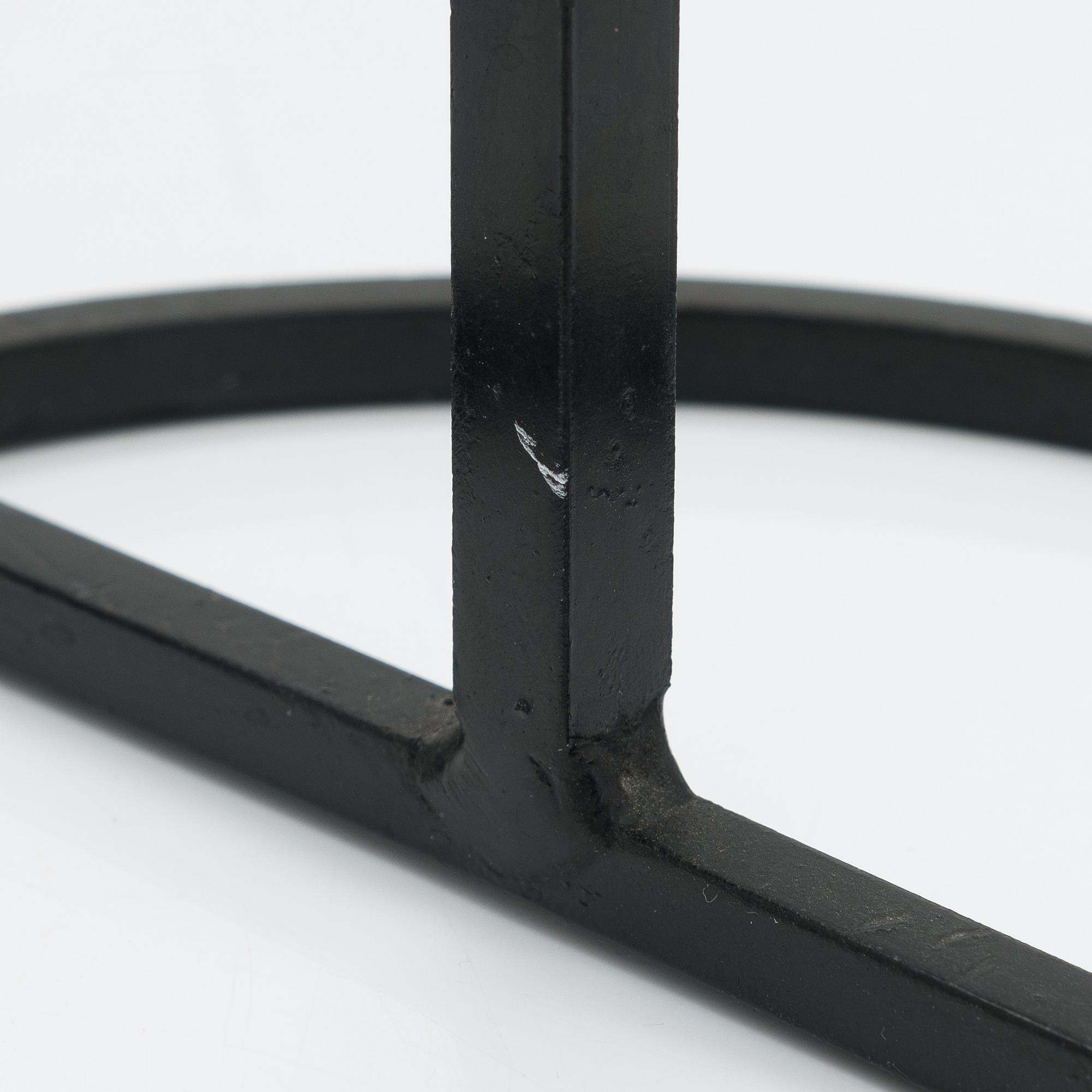 A wrought iron candlestick by Kaija Aarikka, Finland.