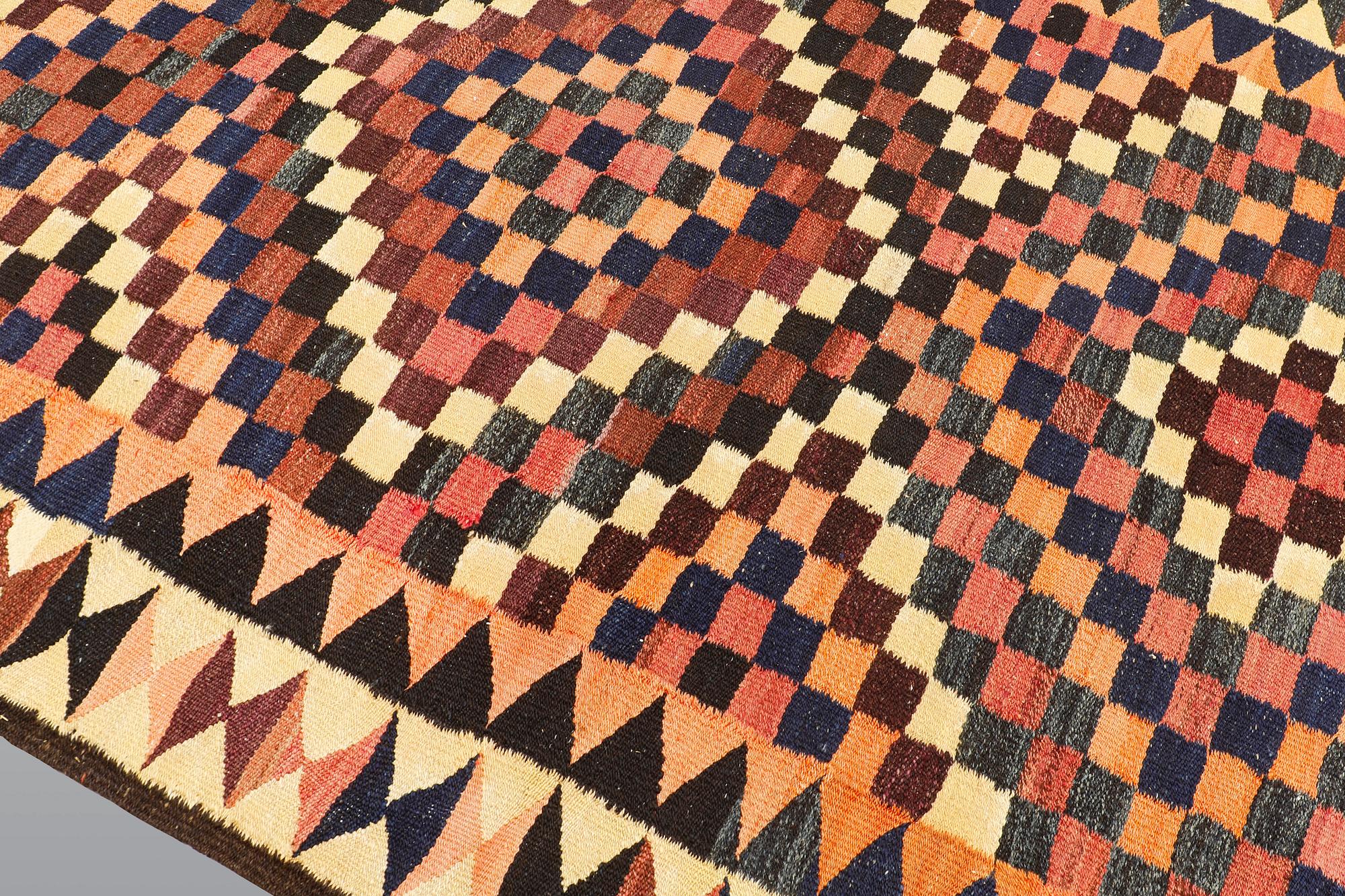 A kilim carpet, ca 333 x 163 cm.