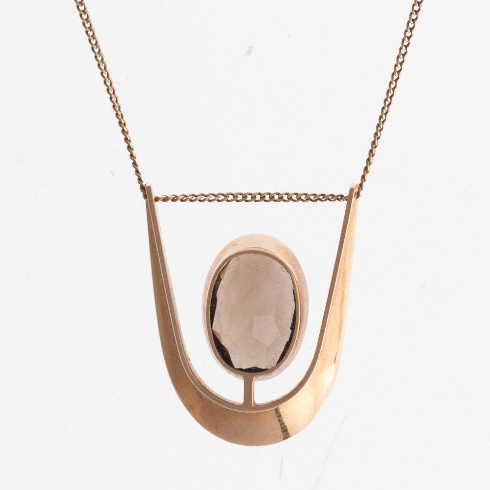Eero Rislakki, A PENDANT, 14K gold, smoke quartz, N. Westerback 1962. Signed ER.