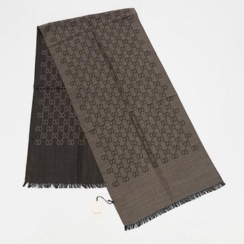 Gucci, a wool and silk mix "GG" jaquard shawl.