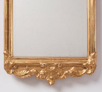 A Swedish Rococo mirror by E Göbel (master in Stockholm 1744-64), dated 1757.