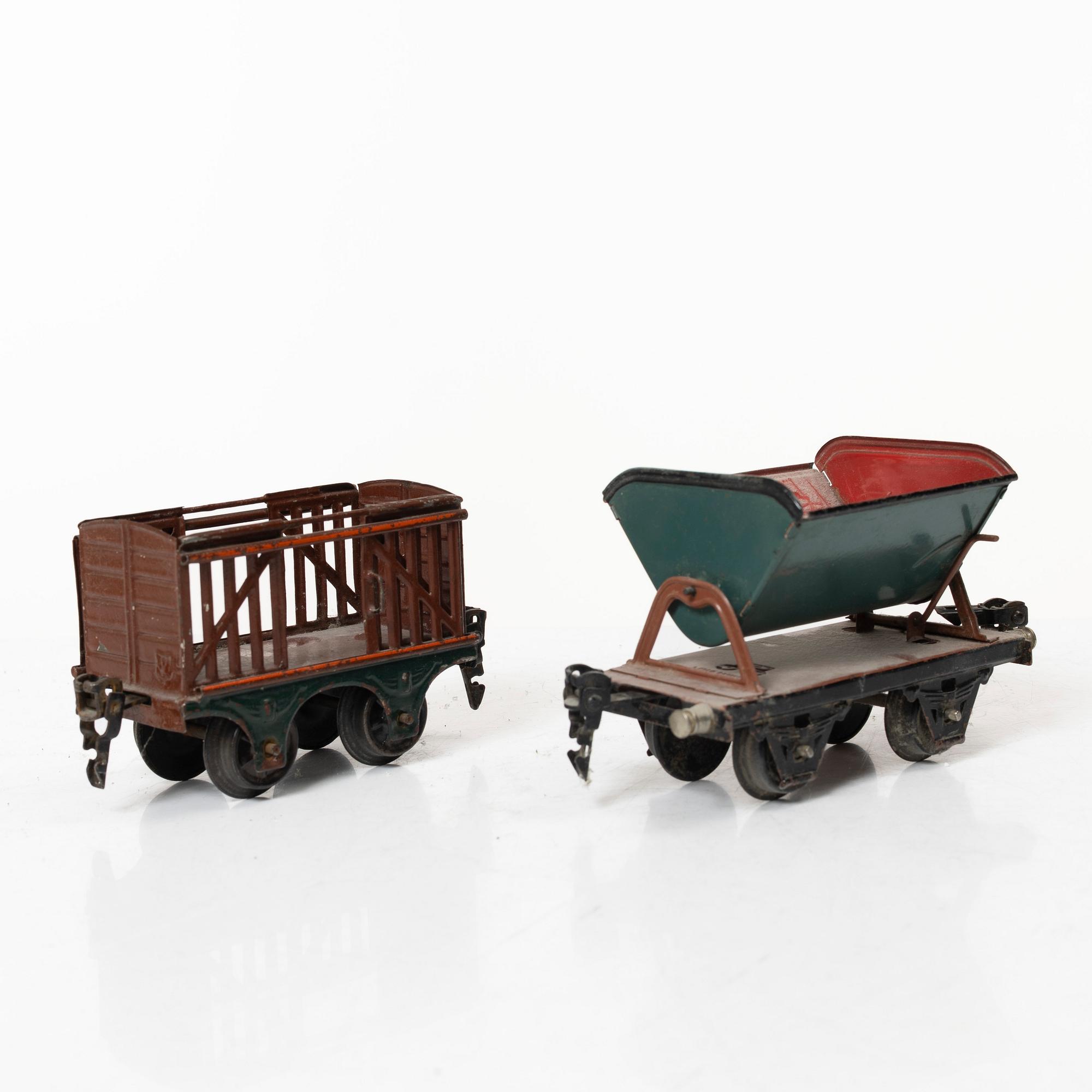 Model train with track and station building, 13 pieces, Germany, 1920s.