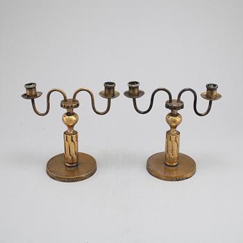 A pair of bronze candelabra, marked H. Bergman, 1920's/30's.