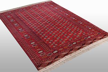 A carpet, semi-antique Tekke, ca 330 x 250 cm.