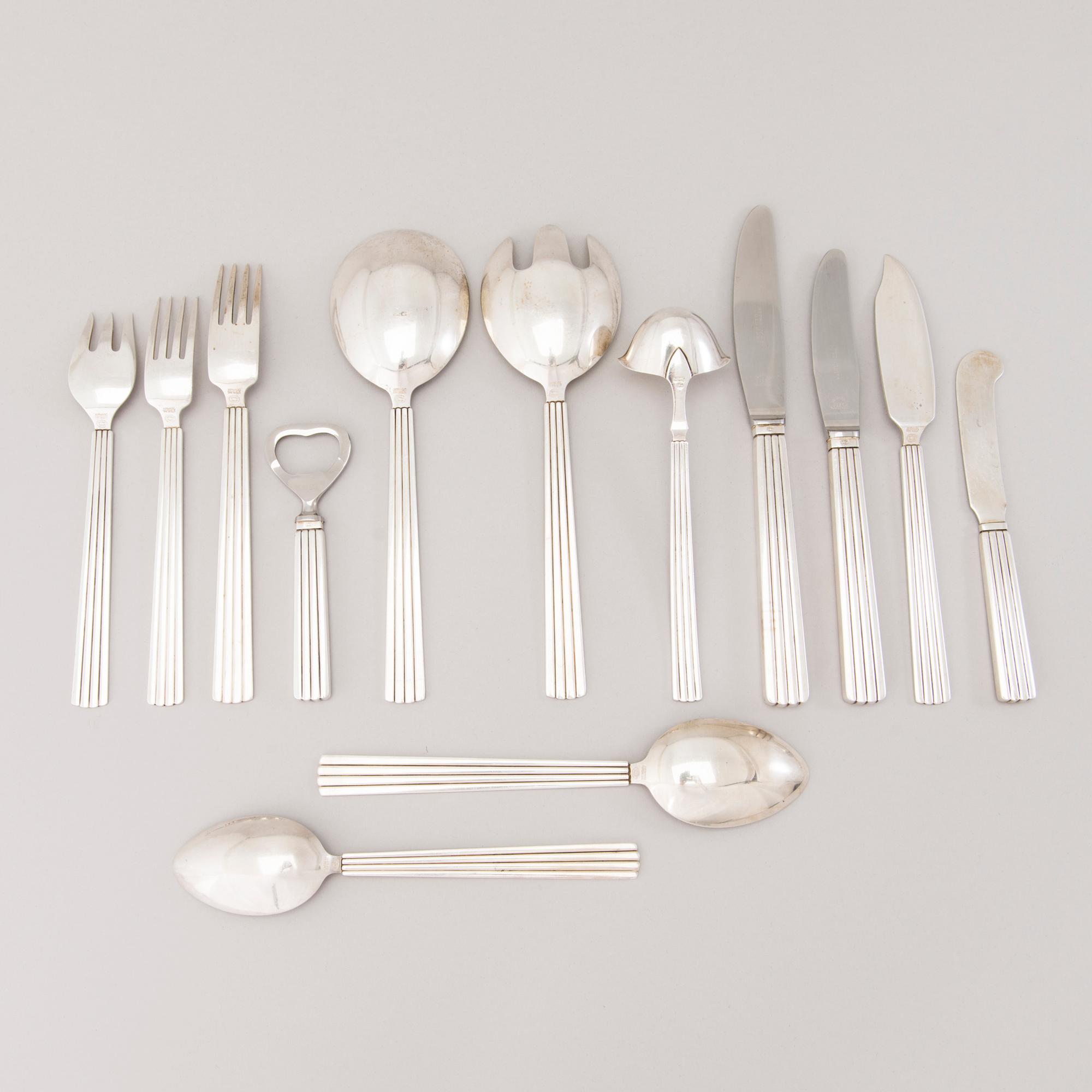 A 106 PIECE SILVER 'Bernadotte' cutlery set for George Jensen Denmark 1945-1977.