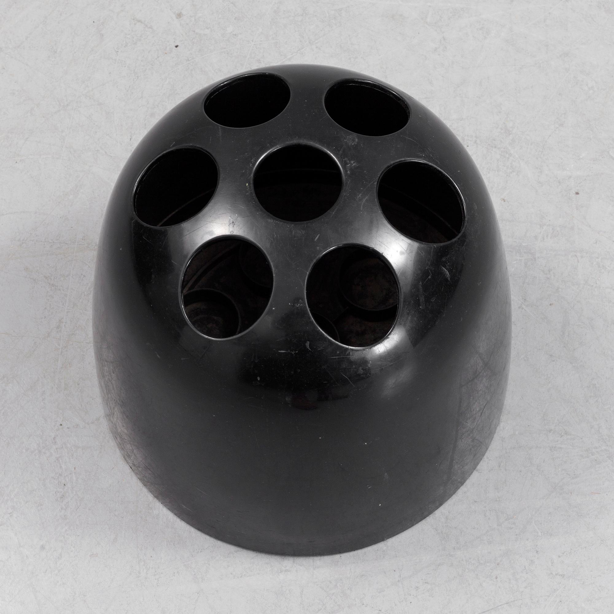 EMMA GISMONDI SCHWEINBERGER, a 'Dedalo' plastic umbrella stand from Artemide, Milan, Italy.