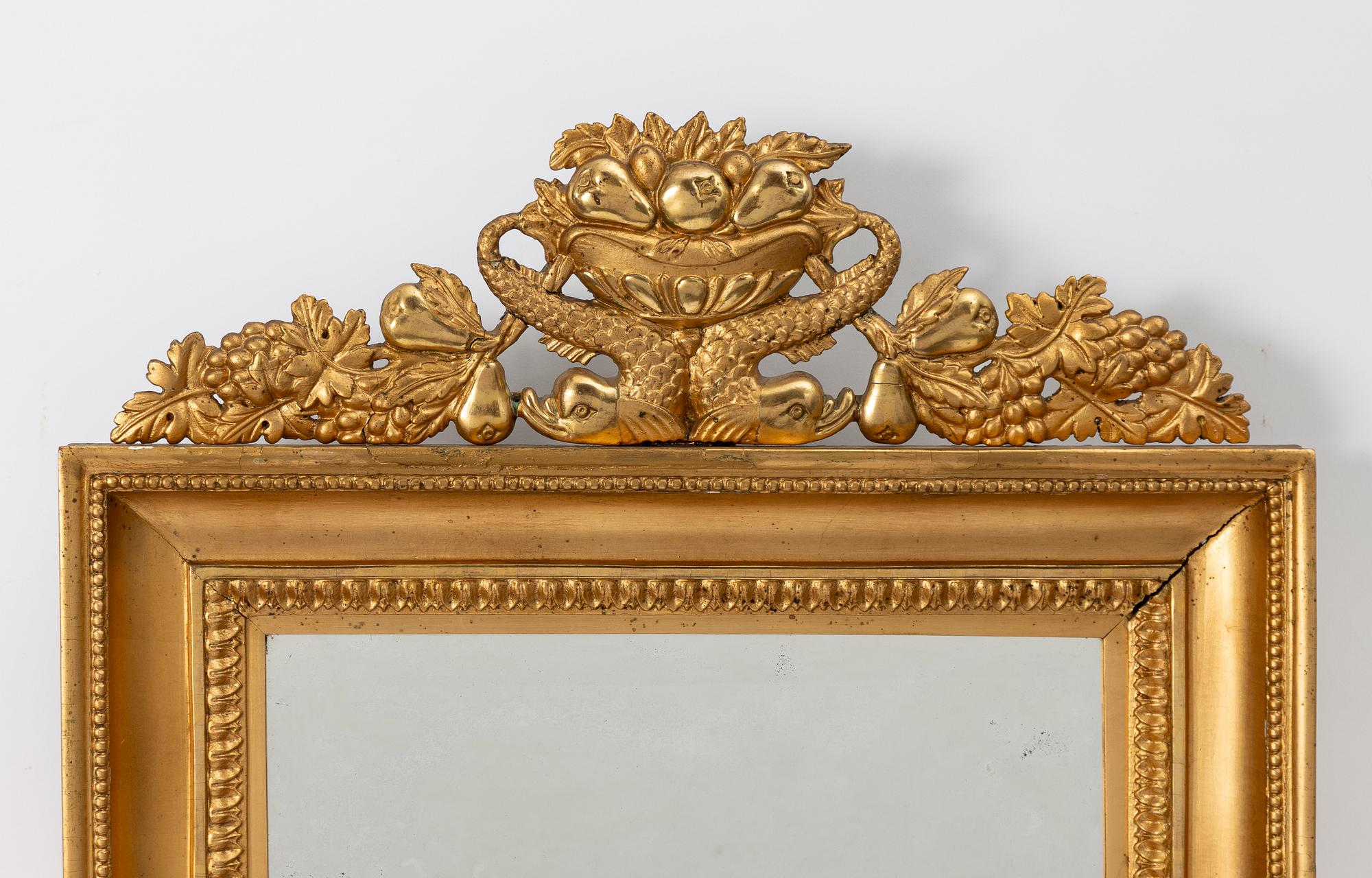 A pair of Late Empire gilded mirror sconces for two candles, Gothenburg, 1830s-40s.