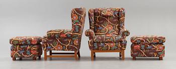 A pair of Svenskt Tenn armchairs with ottomans, model 3543, "Oxford".