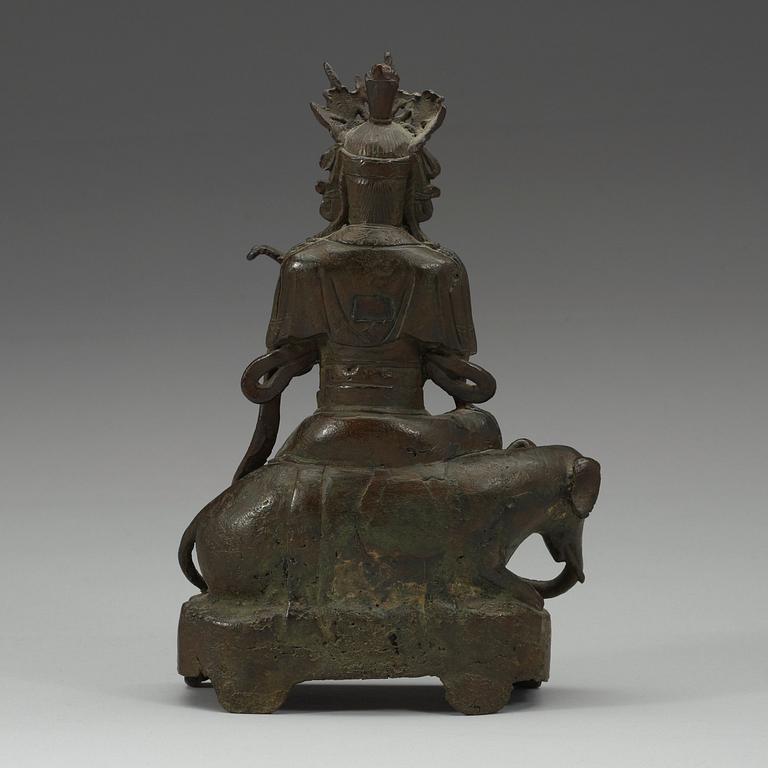 A seated bronze figure of Guanyin on an elephant, Qing dynasty, 19th Century.