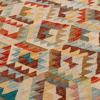 An oriental kilim, around 300 x260 cm.