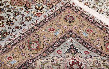 A Tabriz carpet, part silk, so-called 50 Raj, approx. 348 x 252 cm.