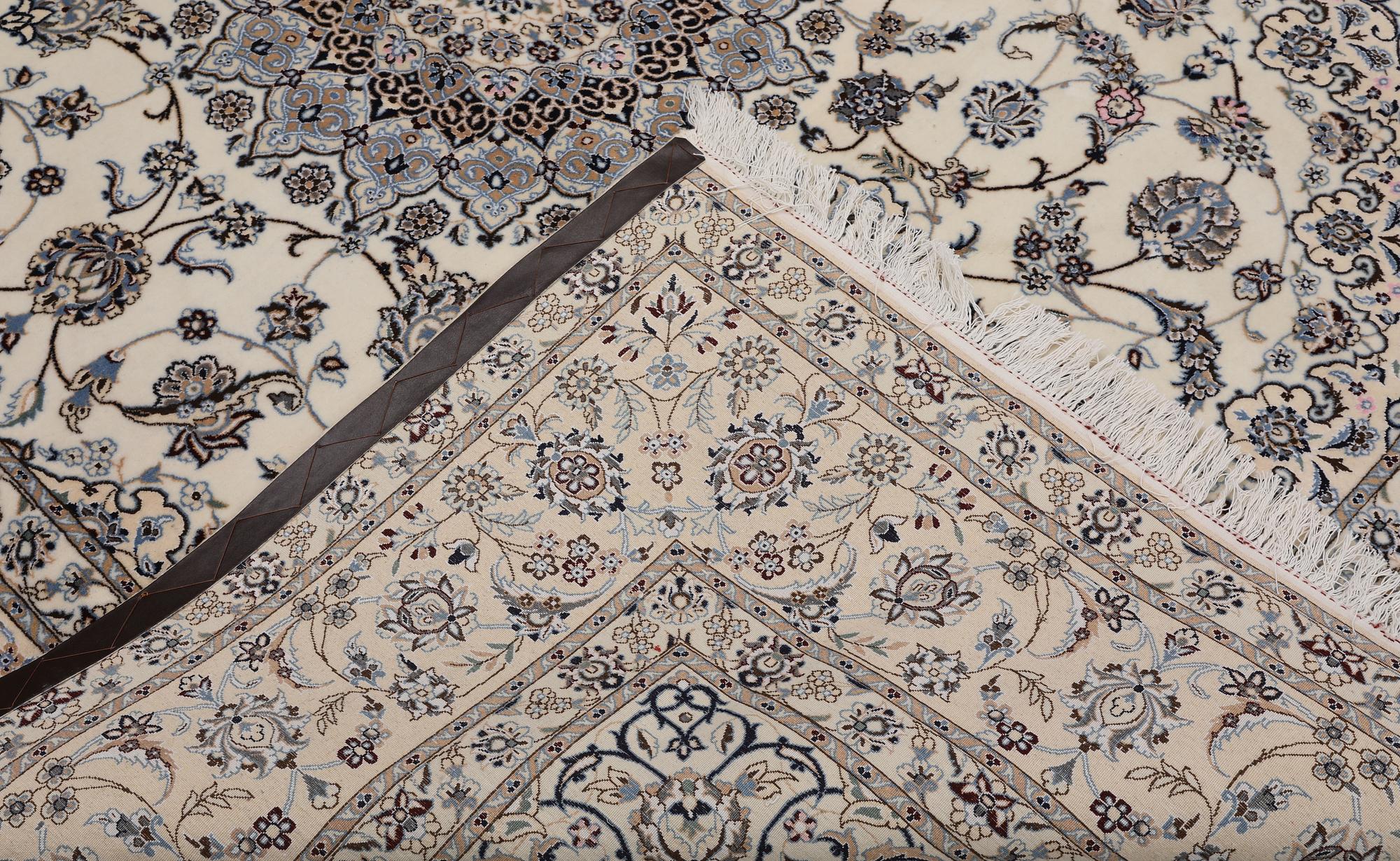 A Nain part silk carpet, 269 x 213 cm.
