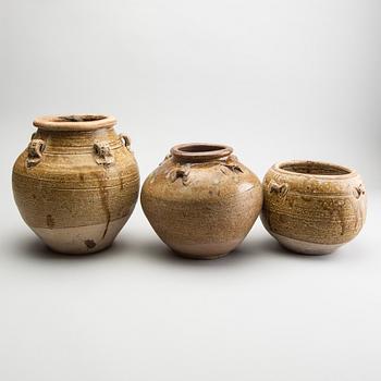 A group of three olive glazed jars, South East Asia, presumably 16th/18th Century.