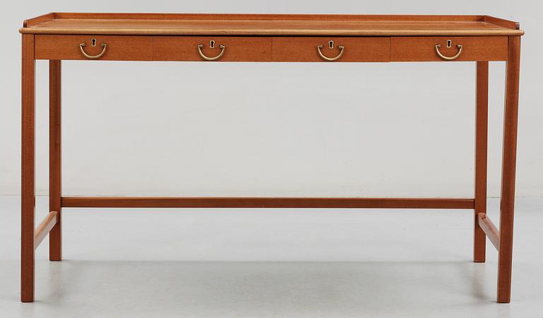 A Josef Frank mahogny desk by Svenskt Tenn.