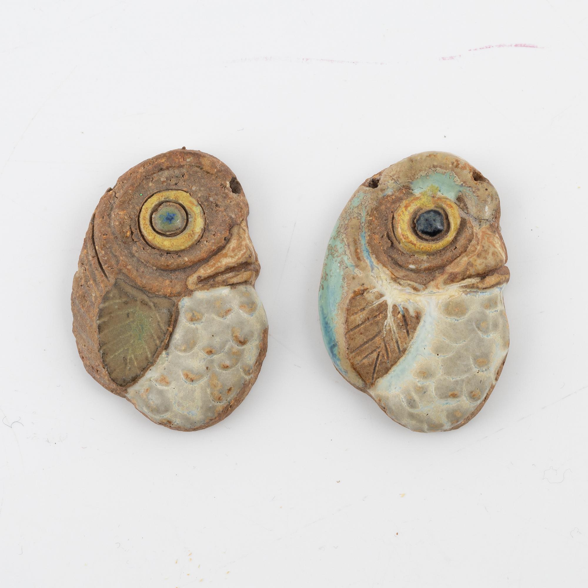 Tyra Lundgren, two stoneware pendants.