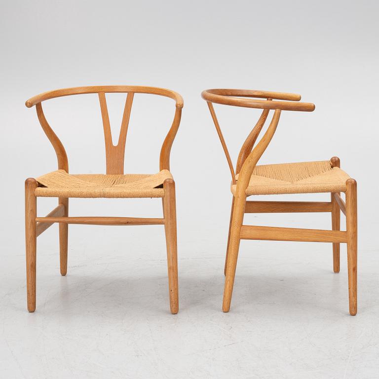 Hans J. Wegner, four model CH-24/ 'Wishbone' chairs, Carl Hansen, Odense, Denmark, second half of the 20th century.