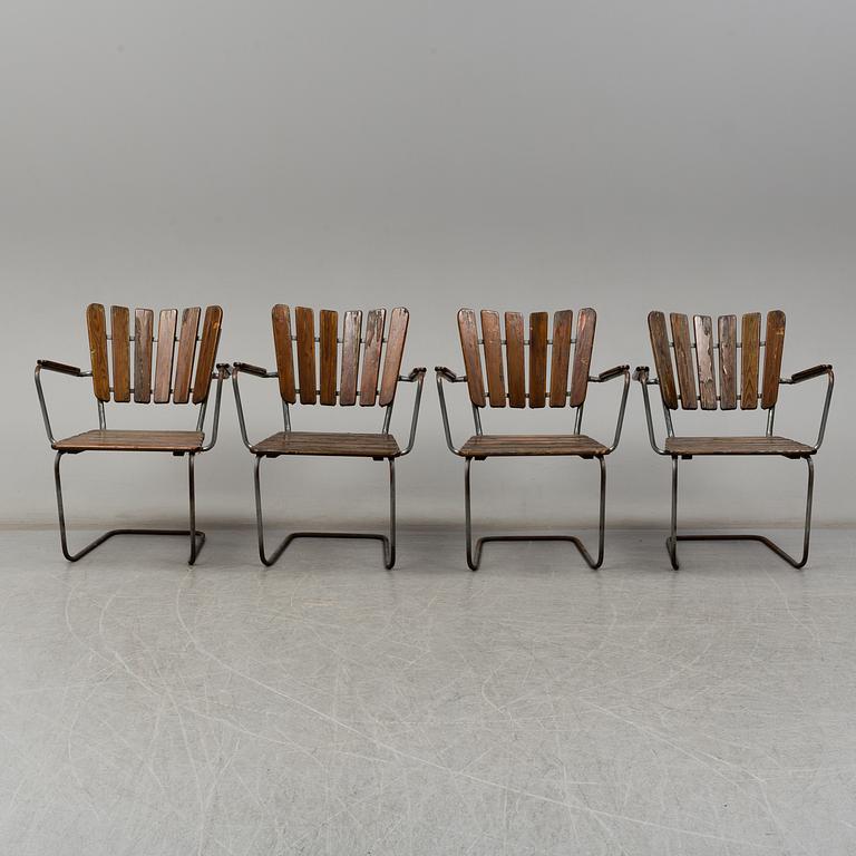 Four tubular steel and pine garden chairs, mid 20th Century.