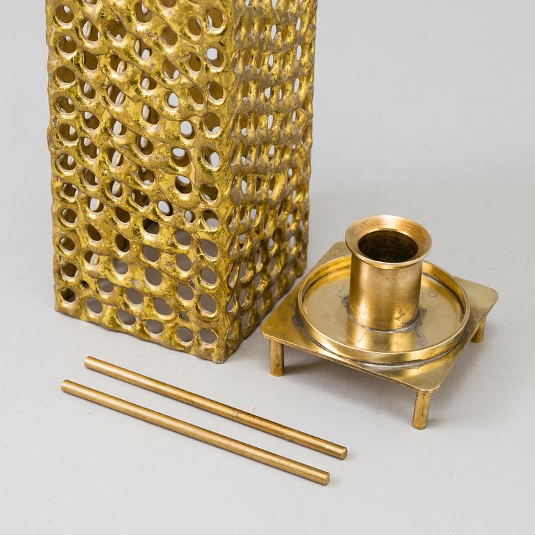 a brass ceiling light by Pierre Forsell for Skultuna.