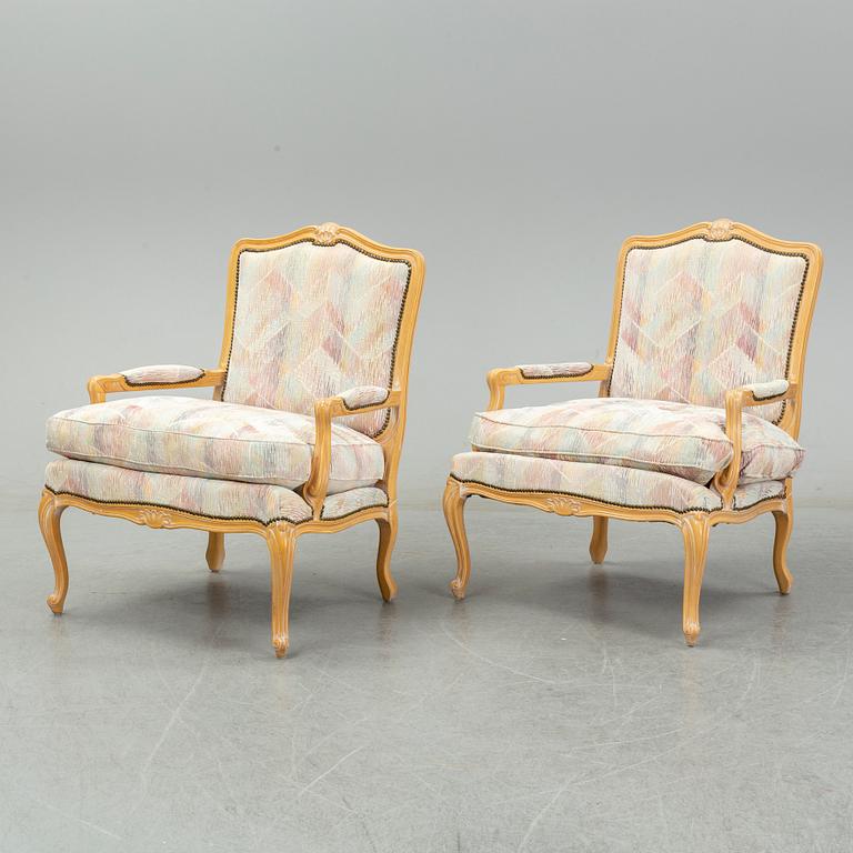 An end of the 20th Century pair of rococo style armchairs.