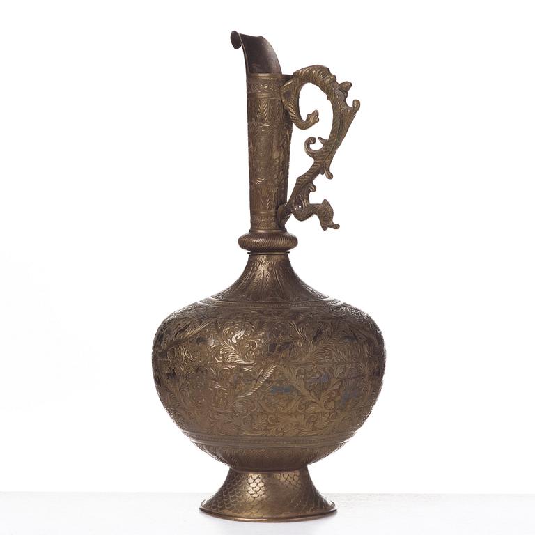 A ROYAL JUG, brass, India second half of the 19th century, height ca 39,5 cm.