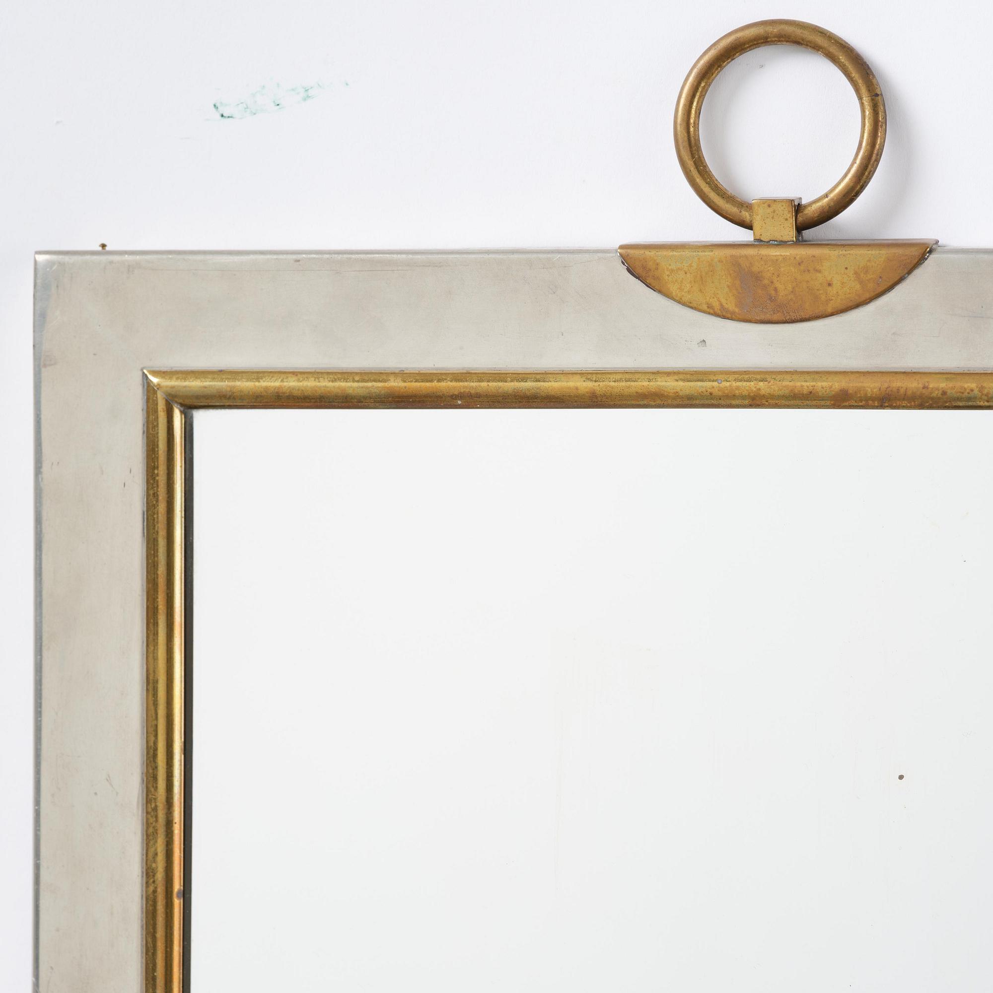 Firma Svenskt Tenn, a pewter and brass wall mirror model 2283, Firma Svenskt Tenn, Stockholm, 1952.