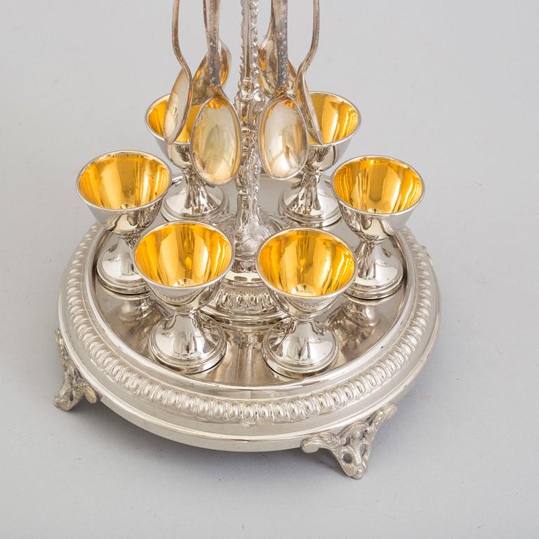 AN EGG CUP STAND, tinplate, fist half of the 20th century.